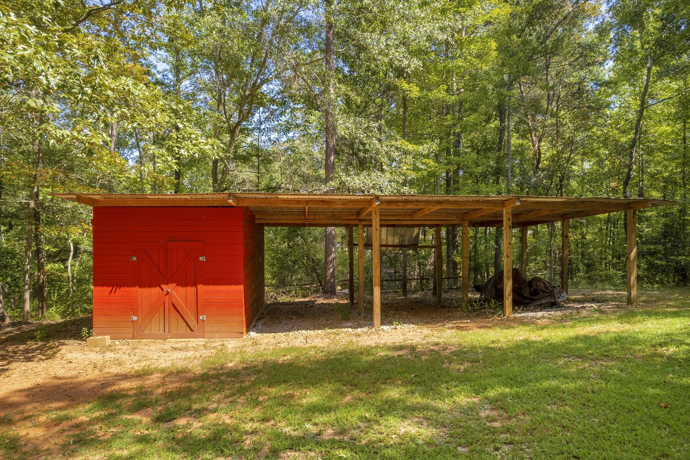 The detached outbuilding with covered storage